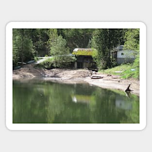 Lake with a bridge with a straw roof Sticker